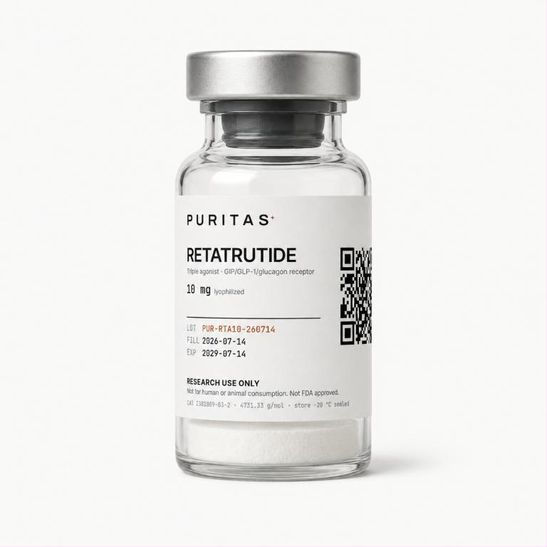 Puritas Retatrutide 10 mg vial containing a white lyophilized cake, label showing lot PUR-RTA10-260714 and a QR code